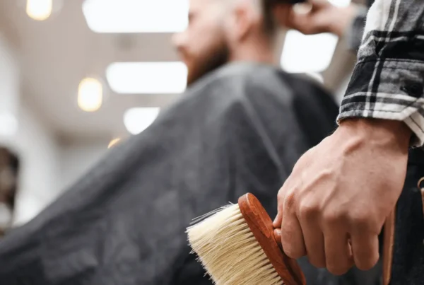 barber uses beard brush